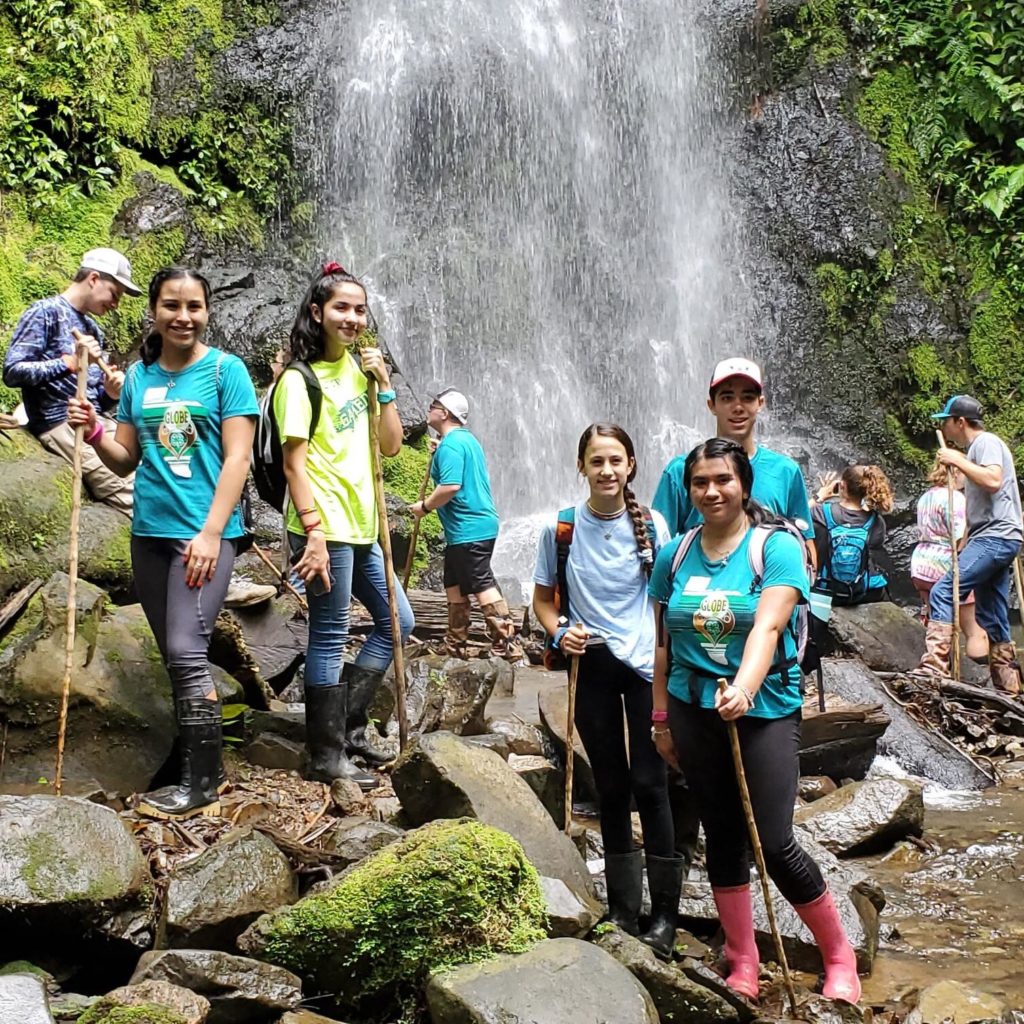 4-H members at a waterfall during the 2019 GLOBE Program